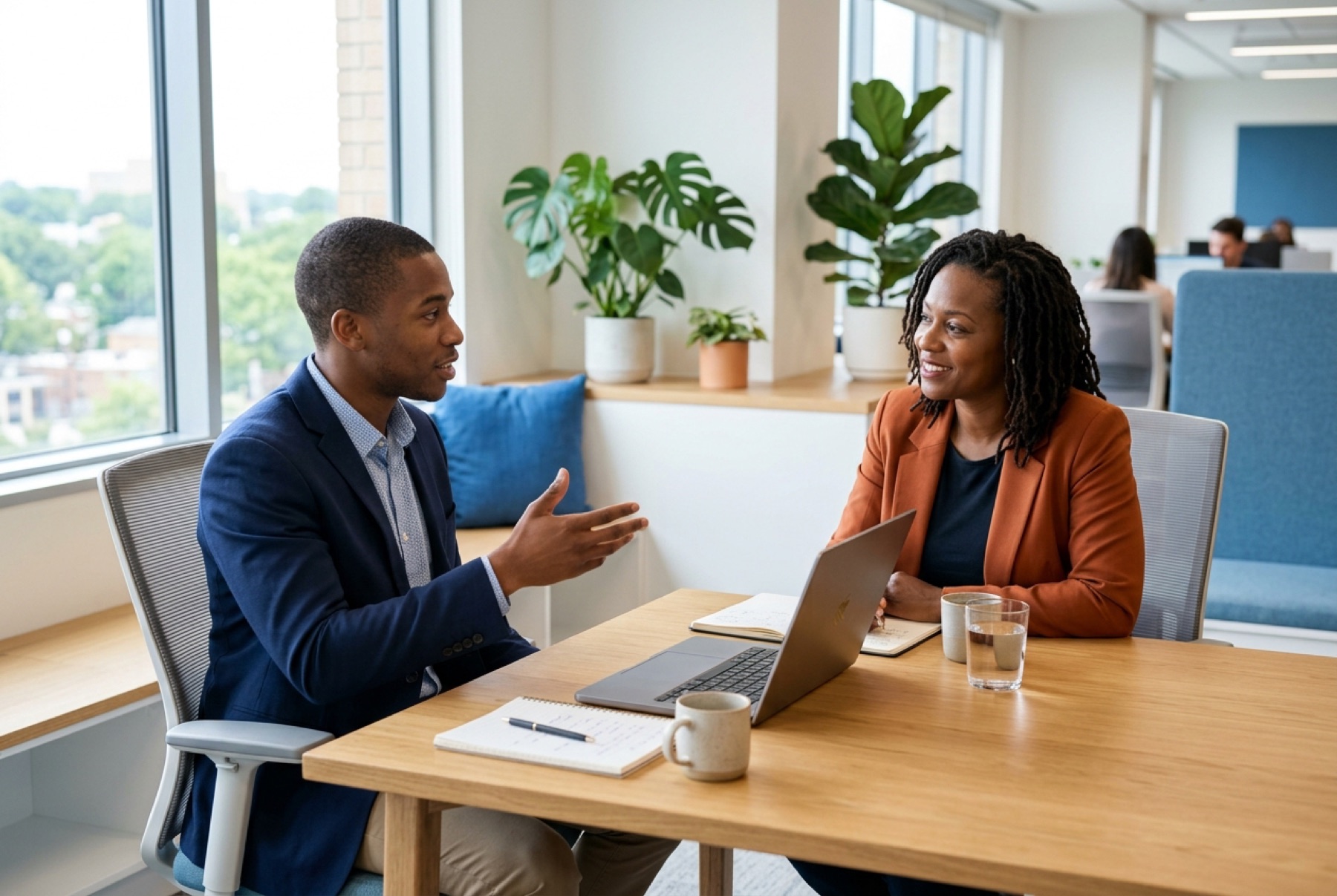 An adviser and a nonprofit founder talking through her documents